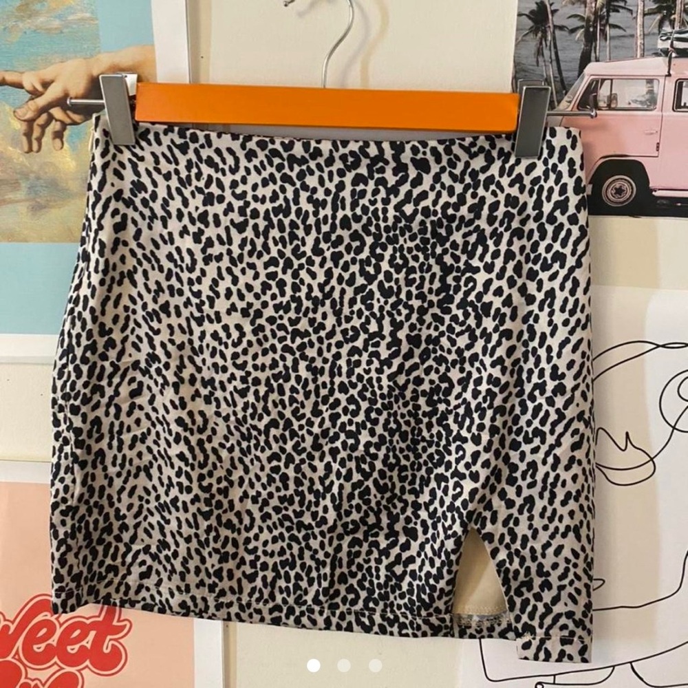 Adika: satin cheeta print mini skirt with cut out on bottom